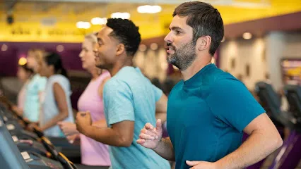 Logo of Planet Fitness